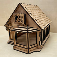 Load image into Gallery viewer, Wooden model of a bookshop engraved with the name "The Book Nook" on the sign,
