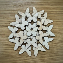 Load image into Gallery viewer, A group of twenty wooden laser cut blank butterfly shapes. Items laid out on a darker wooden background.