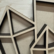 Load image into Gallery viewer, A close up of a large laser cut crystal shaped display shelf, showing this version has holes for it to hang on a wall.