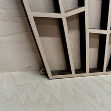 Load image into Gallery viewer, A close up of a large laser cut crystal shaped display shelf, showing this version has holes for it to hang on a wall.