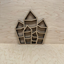 Load image into Gallery viewer, A small laser cut display shelf in the shape of a jagged crystal. Cut from MDF.