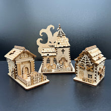 Load image into Gallery viewer, A set of three laser cut models of Halloween buildings. A mausoleum, a church and a house shape.
