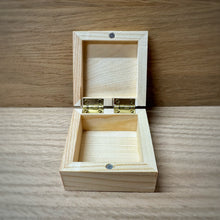 Load image into Gallery viewer, The front and insides of small blank wooden keepsake box with an open lid, showing brass hinges and a magnetic clasp in a light natural wood, placed on a darker wooden surface.