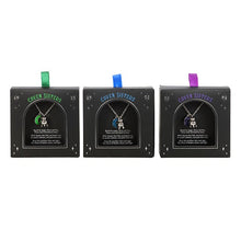 Load image into Gallery viewer, Three 'Coven Sisters' necklaces in packaging with different coloured ribbons which match their pendant colours on a white background.