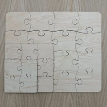 Load image into Gallery viewer, All three sizes of the laser cut puzzle sets stacked on top of each other, from largest to smallest.