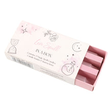 Load image into Gallery viewer, An open Love Spell in a box kit, with witchy themed illustrations on the cover and a barcode on the side. Item on a white background.