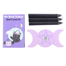 Load image into Gallery viewer, A top down view of the packaging, three of the candles, and the wooden triple moon candle holder with a pentagram and a metal cup laid out on a white background.