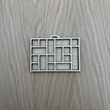 Load image into Gallery viewer, A miniature wooden laser cut tray divided into sections to mimic the old type setter trays. Item on a wooden background.