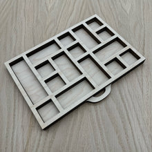 Load image into Gallery viewer, A miniature wooden laser cut tray divided into sections to mimic the old type setter trays. Item on a wooden background.