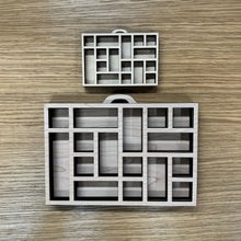 Load image into Gallery viewer, Two miniature wooden laser cut trays divided into sections to mimic the old type setter trays. Items on a wooden background.