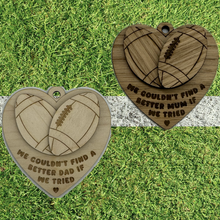 Load image into Gallery viewer, Two laser cut hearts with layered rugby balls and engraved with a message.
