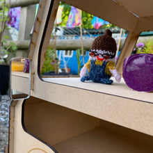 Load image into Gallery viewer, A close up of the open side middle shelf for a 3D laser cut food truck shaped cupcake stand. A small working mirror sticks out like a wing mirror. A knitted gnome and other items are on the inside shelf for display.