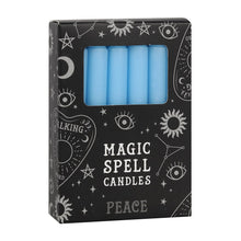 Load image into Gallery viewer, A pack of 12 black Magic Spell Candles in a black cardboard box with a witch themed pattern and the word "Peace" at the bottom. The light blue candles can be seen in a cut out window in the packaging. Item on a white background.