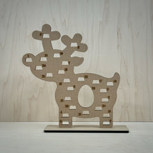 Load image into Gallery viewer, Freestanding MDF Reindeer Advent calendar on a wooden background. 
