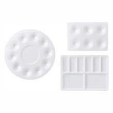 Load image into Gallery viewer, Three varying shaped paint palettes. One circular paint palette with ten paint wells, and two rectangular palettes; one with six larger paint wells and another with eight paint wells. The last has two larger paint wells and six smaller ones. Items on a white background.
