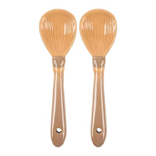 Load image into Gallery viewer, Two Ceramic spoons in broomstick style design. The twig end makes up the bowl of the spoons and the broom handle makes up the neck of the spoon. There's a small hole in the handle to hang them. Items are on a white background.
