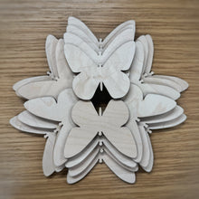 Load image into Gallery viewer, A group of twenty wooden laser cut blank butterfly shapes. Items laid out on a darker wooden background.
