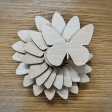 Load image into Gallery viewer, A group of twenty wooden laser cut blank butterfly shapes. Items laid out on a darker wooden background.
