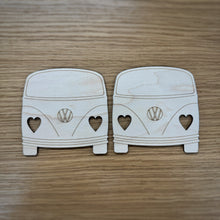 Load image into Gallery viewer, Two wooden laser-cut van-shapes with heart-shaped headlights cut out. Displayed on a wood grain surface.
