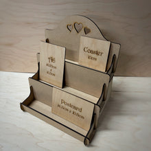 Load image into Gallery viewer, MDF display stand with heart designs cut out on the back board on a wooden background. Shelves have display cards to show their sizes on the shelves.
