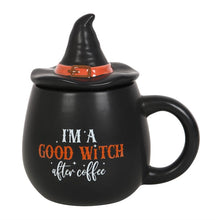 Load image into Gallery viewer, A black mug with a witch's hat lid and the text 'I'm a good witch after coffee' printed on it in white and orange text. Item on a white background.
