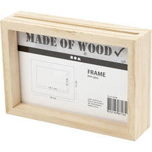 Load image into Gallery viewer, A double sided pine photo frame on a white background. The label inside the frame shows the dimensions in a diagram, along with the manufacturer info and barcode. A slot is visible at the top where the photo or flat items will be inserted into the frame.
