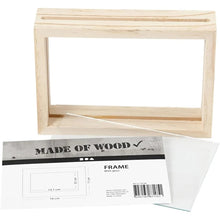 Load image into Gallery viewer, A double sided pine photo frame on a white background. The label and glass panes have been removed to show the parts the frame makes up. The label shows the frame's dimensions in a diagram, along with the manufacturer info and barcode. A slot is visible at the top where the photo or flat items and the glass will be inserted into the frame.
