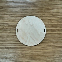 Load image into Gallery viewer, A blank wooden laser cut circular bead shape to build a friendship bracelet bunting.
