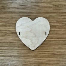 Load image into Gallery viewer, A blank wooden laser cut heart bead shape to build a friendship bracelet bunting. 
