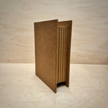 Load image into Gallery viewer, A closed blank book shaped MDF box with a ribbed side to emulate pages.
