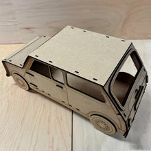 Load image into Gallery viewer, The top, detailed side, and back, of a 3D MDF laser cut cupcake stand in the shape of a classic mini car. Item has layered wheels, door hinges, door handle, and fuel cap. Item on a light wooden background. 
