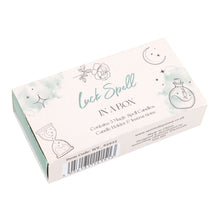 Load image into Gallery viewer, A Luck Spell in a box kit. with witchy themed illustrations on the cover and a barcode on the side. Item on a white background.
