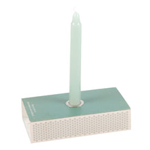 Load image into Gallery viewer, The bottom of the spell kit with a candle resting inside the metal candle holder on the base.
