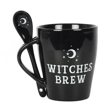 Load image into Gallery viewer, A black mug with 'WITCHES BREW' text and a moon and star design on the handle and spoon.
