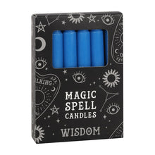 Load image into Gallery viewer, A pack of 12 black Magic Spell Candles in a black cardboard box with a witch themed pattern and the word "Wisdom" at the bottom. The blue candles can be seen in a cut out window in the packaging. Item on a white background.
