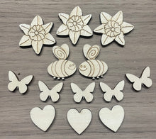 Load image into Gallery viewer, A collection of small laser cuts for a spring themed craft project. Featuring daffodils, bees, butterflies, and hearts.
